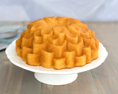 Nordic Ware Blossom Bundt Pan on counter showcases garden-inspired baking appeal.