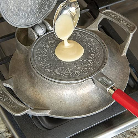 Nordic Ware cast aluminum base with large well for cleaner batter handling.