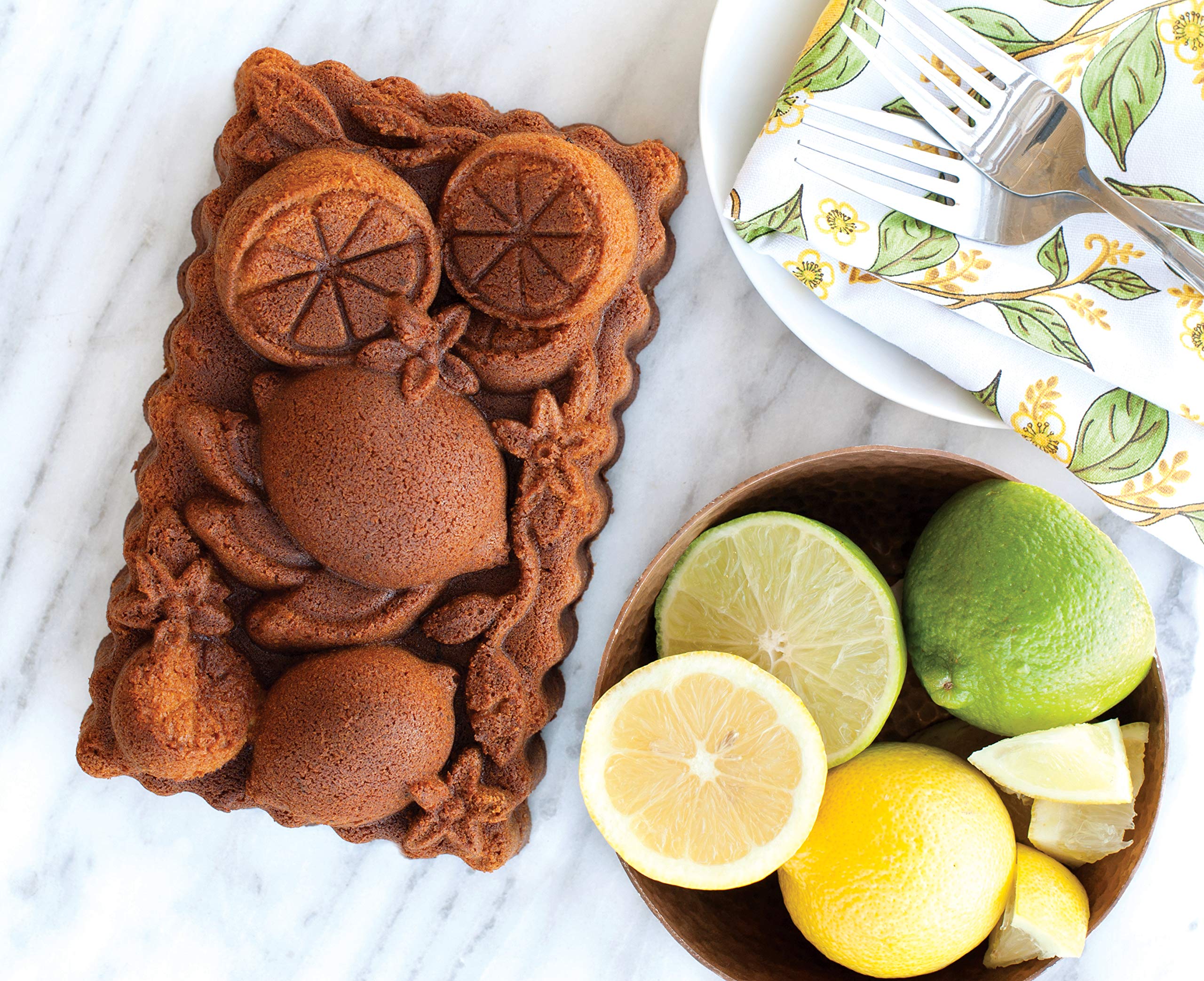 Nordic Ware Citrus Blossom Loaf Pan in oven for even browning