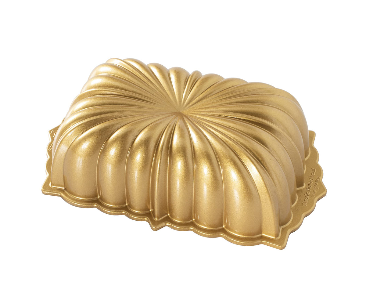 Nordic Ware Classic Fluted Loaf Pan side-angle view in gold highlighting detailed texture