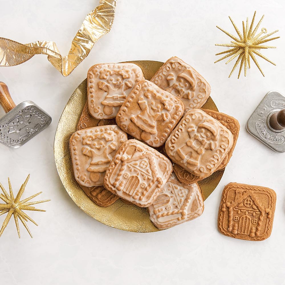 Dough being pressed with Nordic Ware gingerbread designs