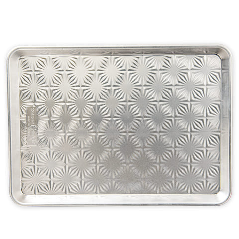 Nordic Ware embossed Naturals starburst pattern enhances browning and air flow.