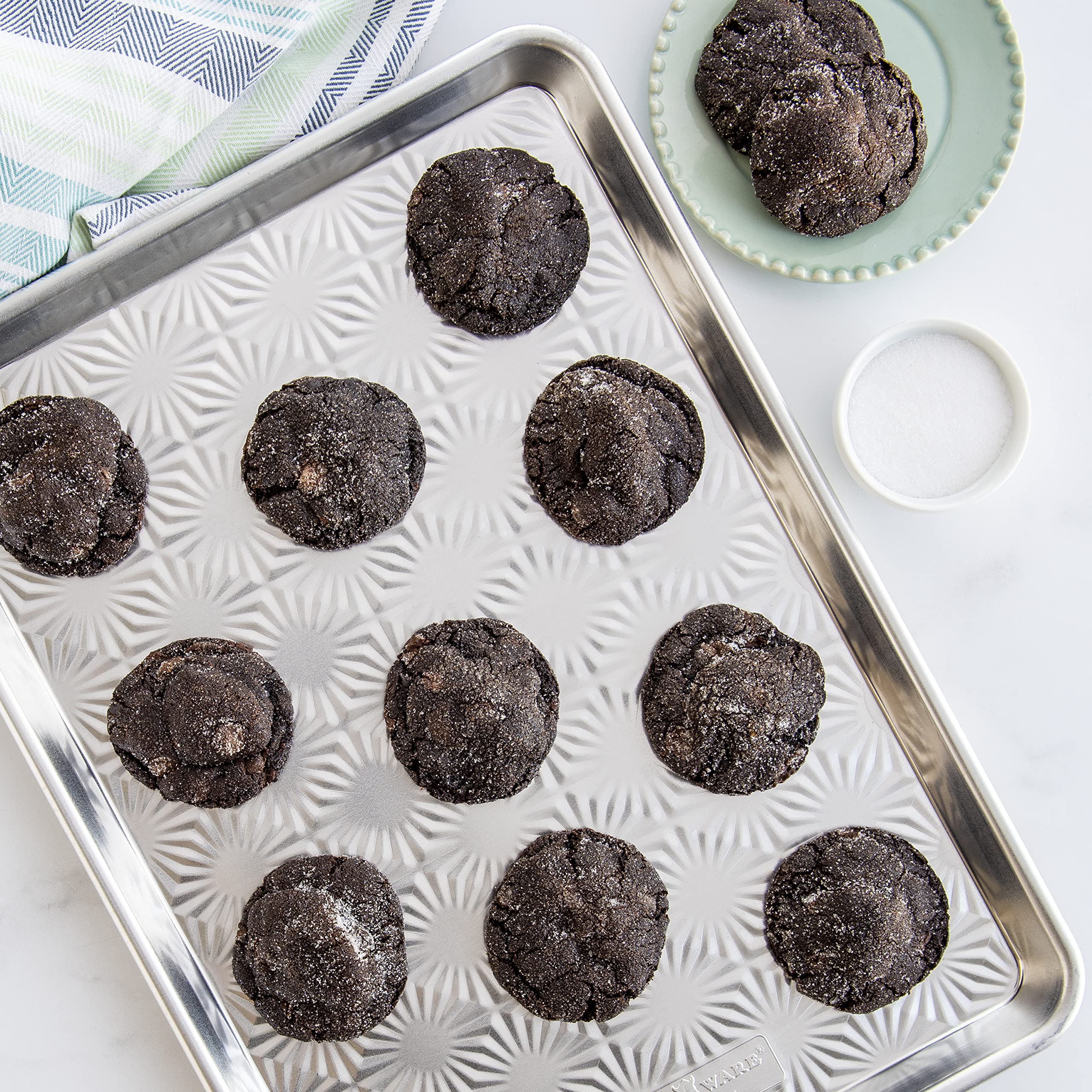 Nordic Ware half-sheet exterior shows durable frame for large batches.