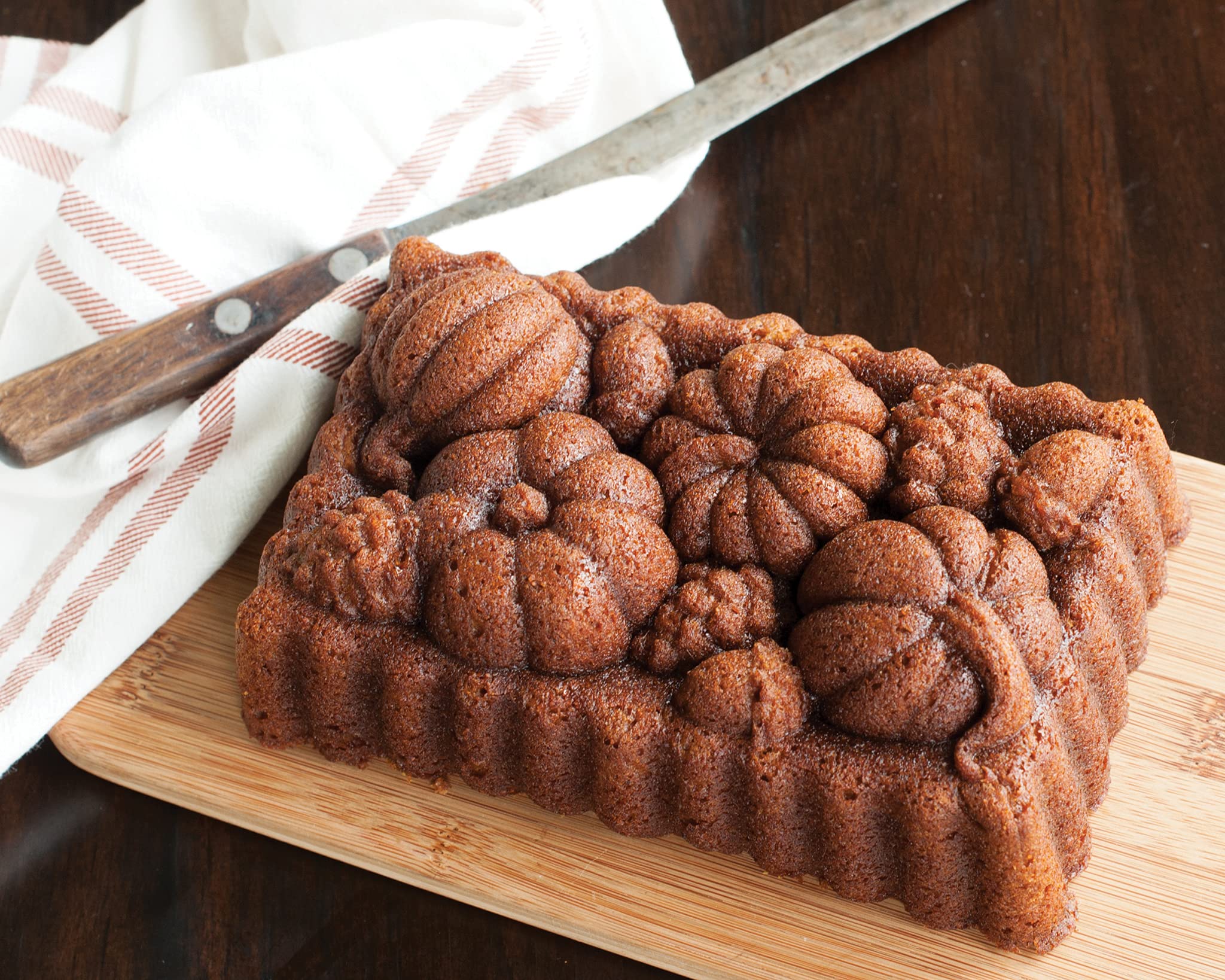 Nordic Ware Harvest Bounty Loaf Pan textured edges emphasize a Bundt-inspired design for even bake.