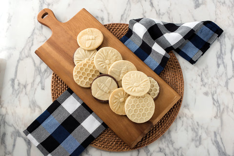Nordic Ware Honeybee stamp with wooden handle closeup for comfortable grip