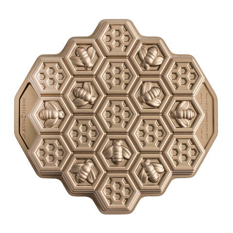 Nordic Ware honeycomb pull-apart pan top view shows 10-cup capacity for precise cakelets and even browning.