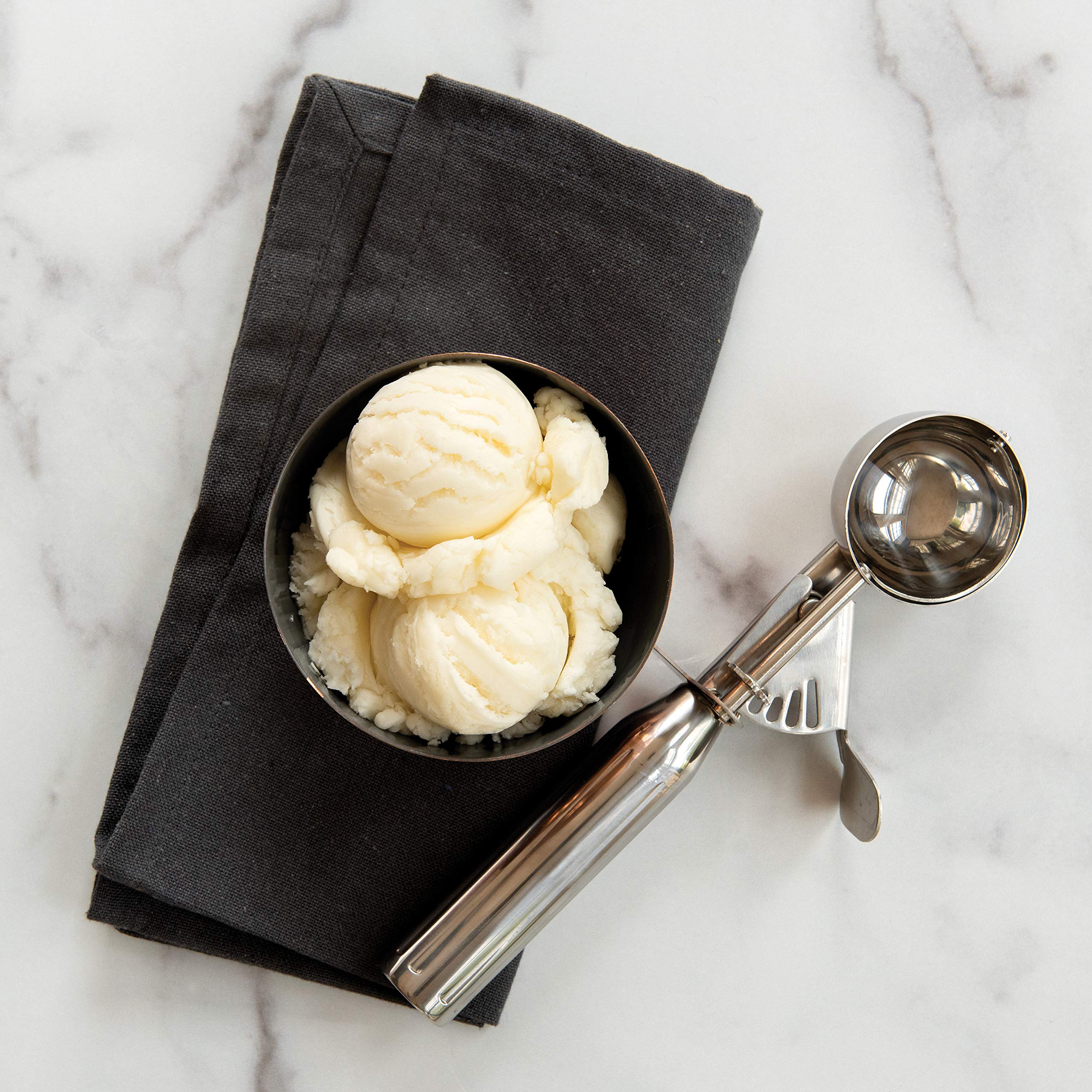 Nordic Ware scoop beside ice cream for precise 3 Tbsp portions.