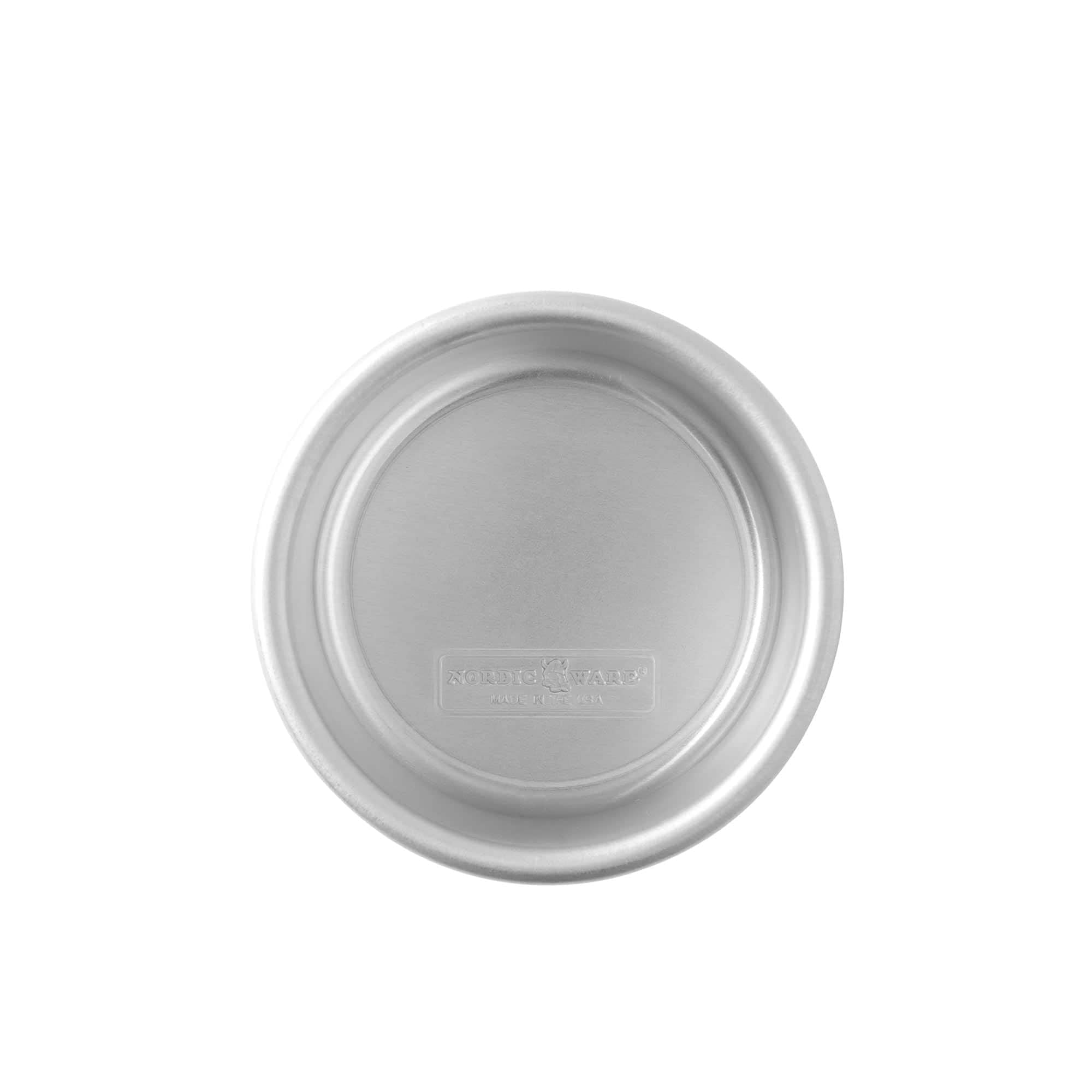 Nordic Ware Naturals 4-inch pan close-up highlights encapsulated rim preventing warping.