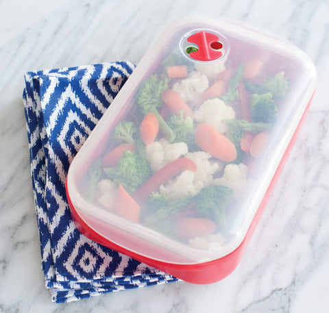 Nordic Ware Steam Cooker removable-tray elevates food for even steaming.