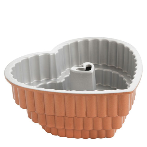 Nordic Ware Tiered Heart Bundt pan detail highlights even browning and intricate heart shapes.