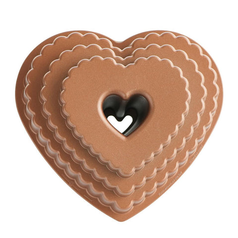 Nordic Ware Tiered Heart Bundt pan exterior shows durable cast aluminum for crisp cake edges.