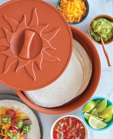 Close-up of tortillas inside the Nordic Ware warmer for quick, warm serving.