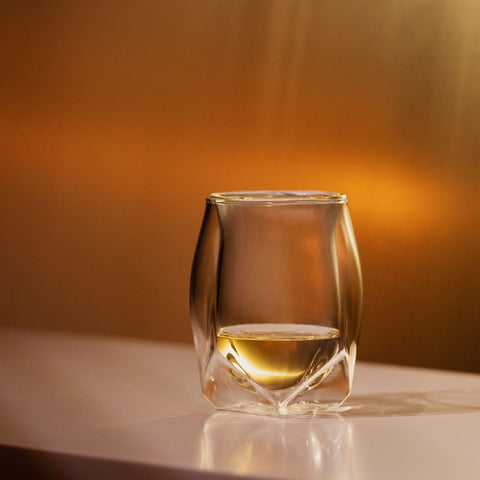 NORLAN Whisky Glass swirling whiskey to showcase color and aroma