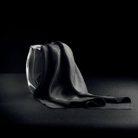 NORLAN Whisky Glass unboxing showing premium packaging and care accessory