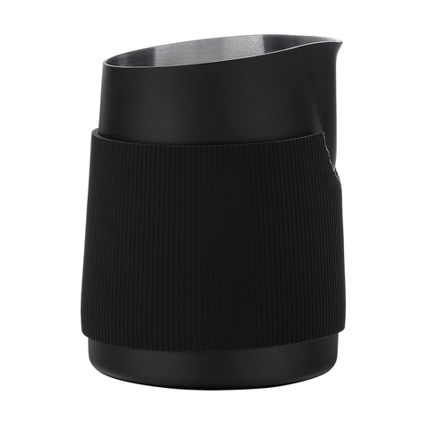 Normcore handleless milk pitcher heat-resistant grip aids steady steaming.