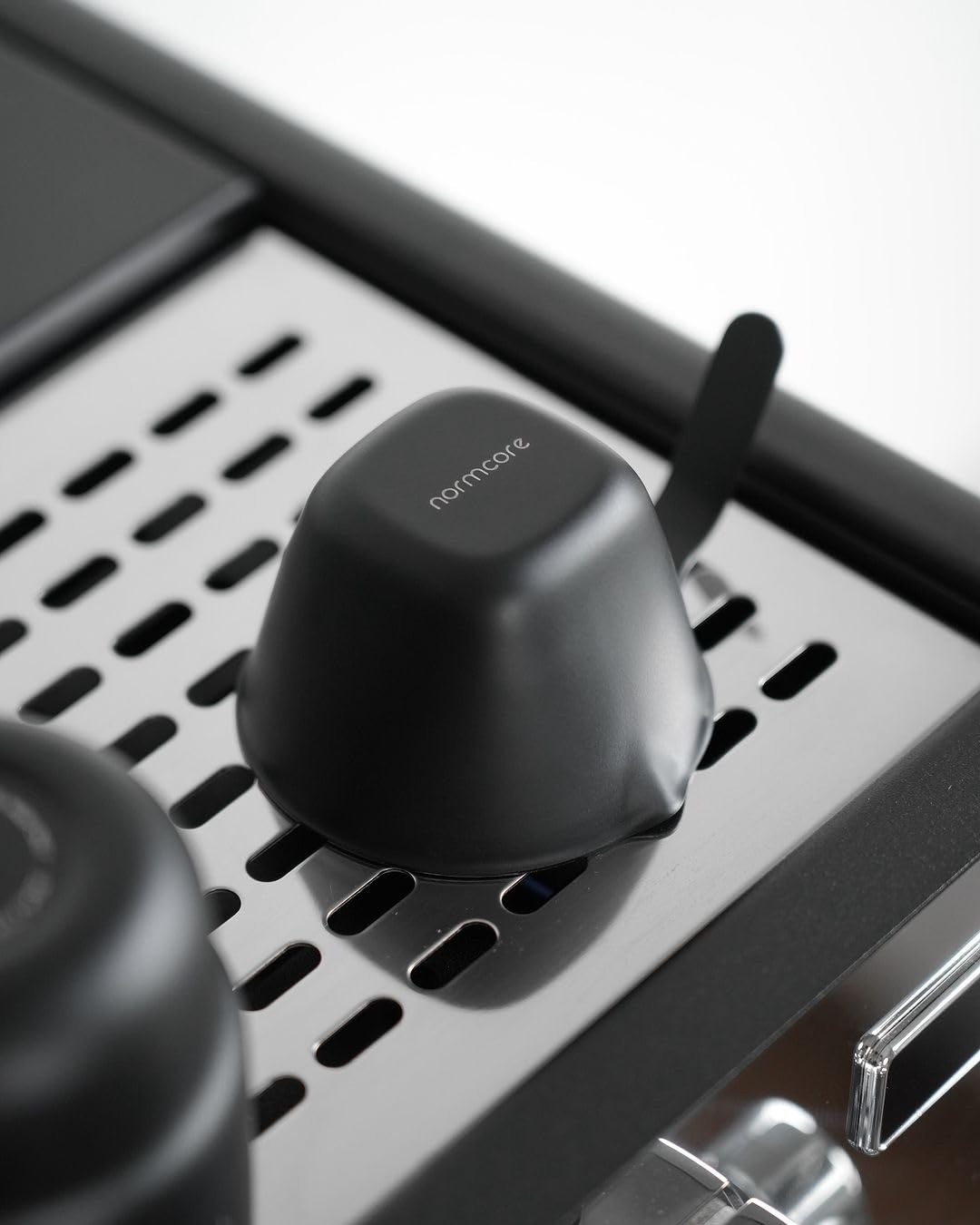 Normcore matte black espresso measuring cup adds understated style to prep