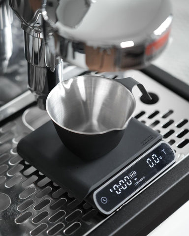 Normcore Pocket Coffee Scale V3 on desk setup showing compact size.