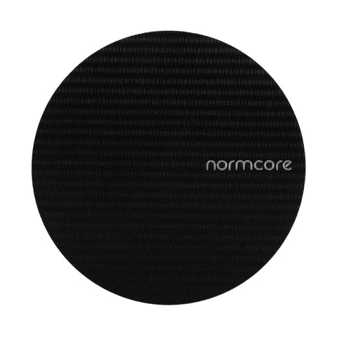 Normcore puck screen with titanium PVD coating, ready for durable espresso use and easy cleaning