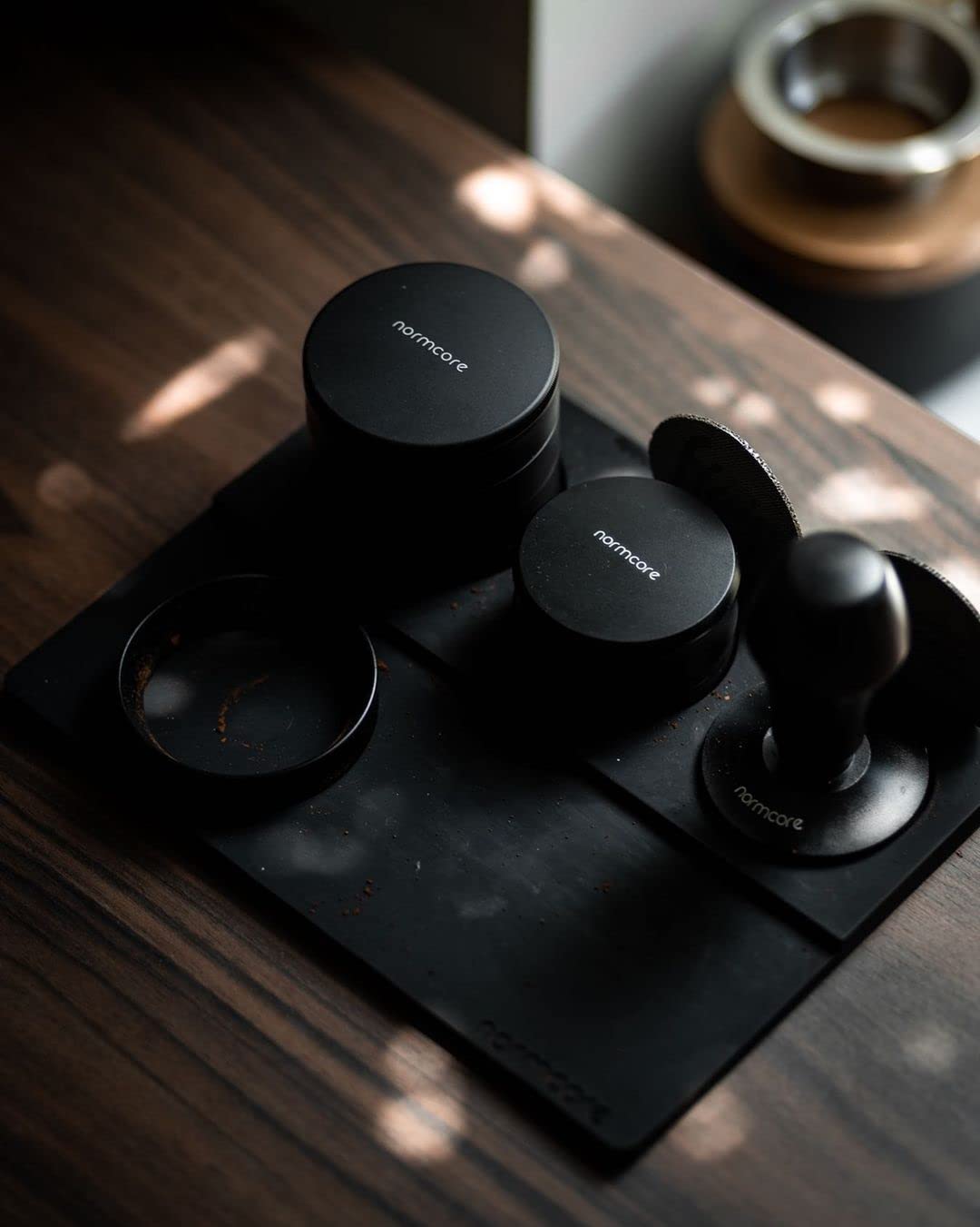 Normcore Tamp Mat with built-in stand keeps tamper within easy reach on the workstation