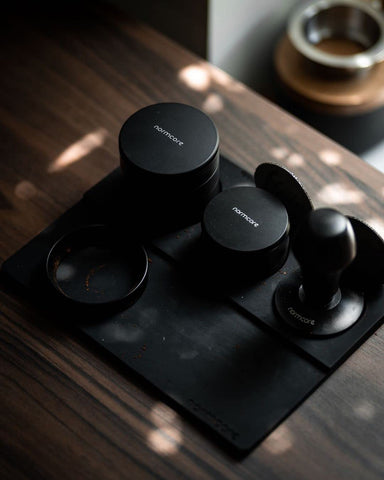 Normcore Tamp Mat with built-in stand keeps tamper within easy reach on the workstation