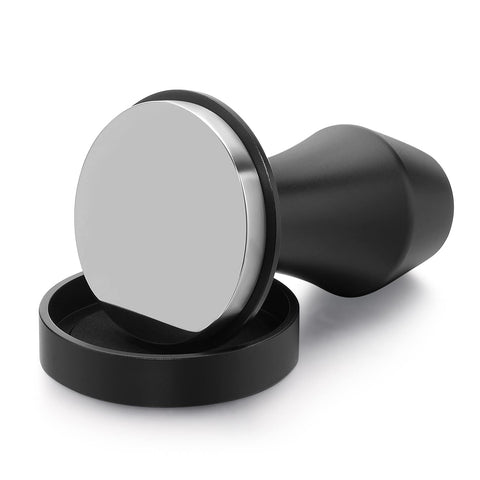 Normcore V4 cafe user demonstrating precise tamping technique