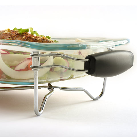 Norpro expanding trivet with heat-resistant handles ready for hot plates.