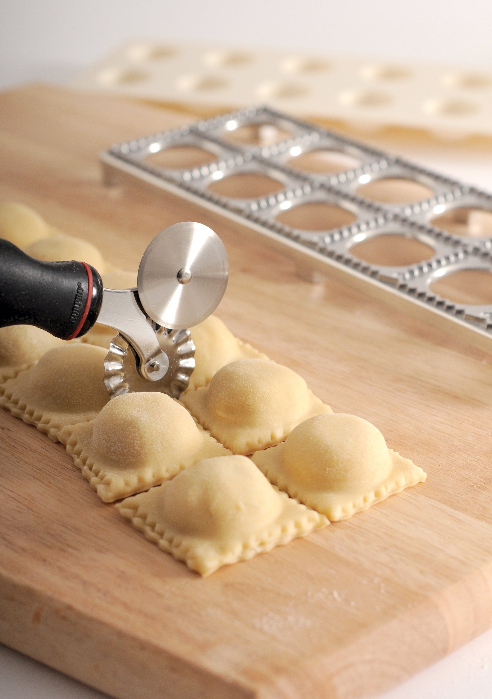 Norpro Grip-EZ wheel in use on pasta dough for lattice shapes