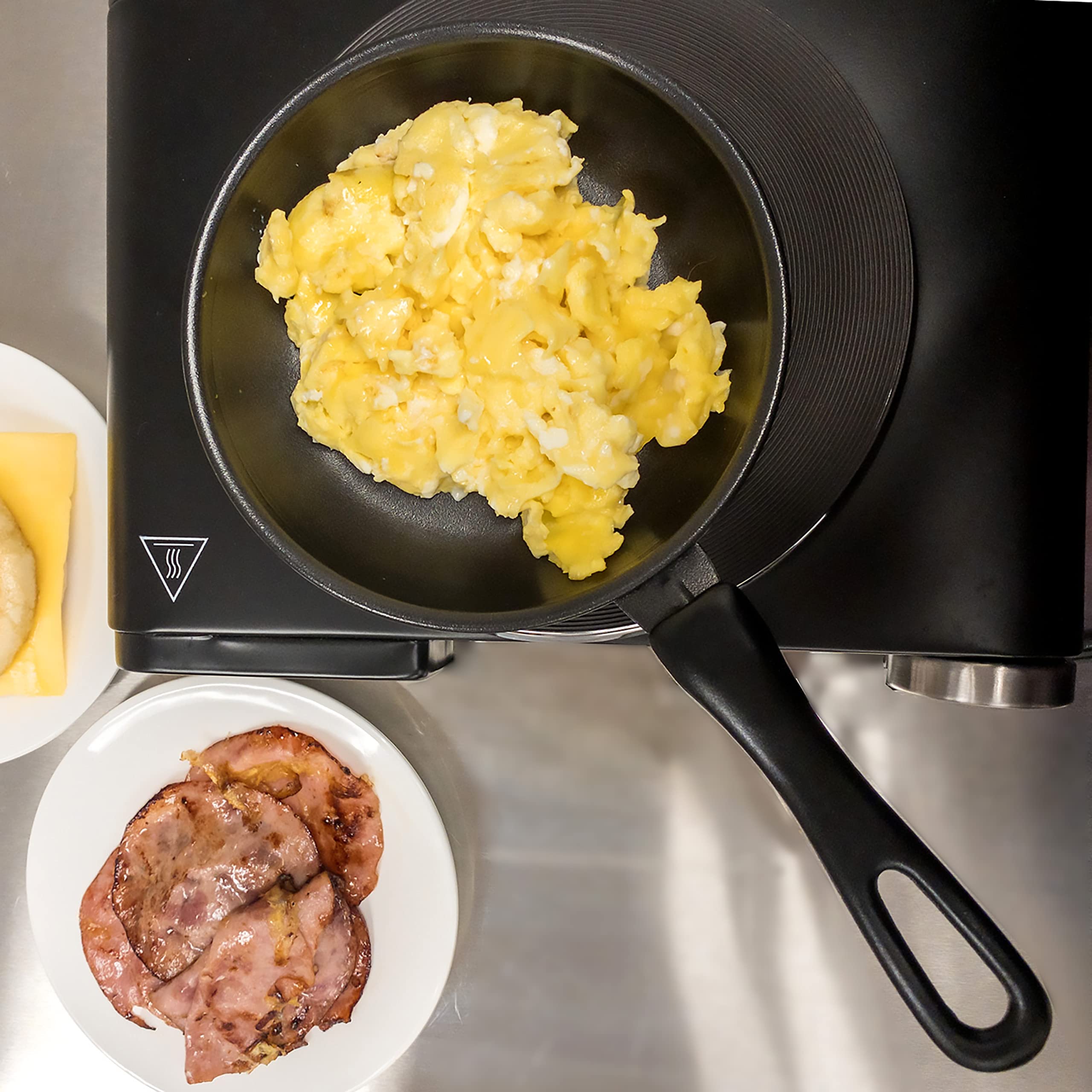 Norpro mini nonstick pan sautéing vegetables evenly in a compact 6-inch pan.