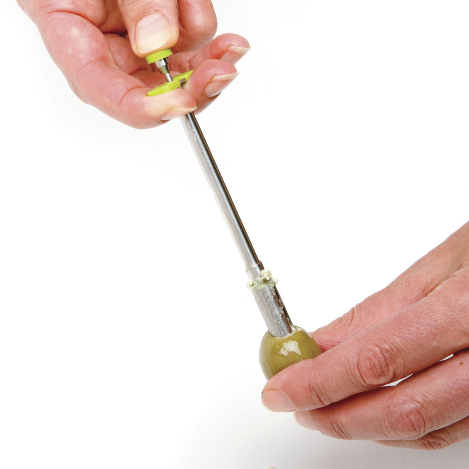 Norpro olive stuffer with green handle enabling precise hors d'oeuvres fillings.