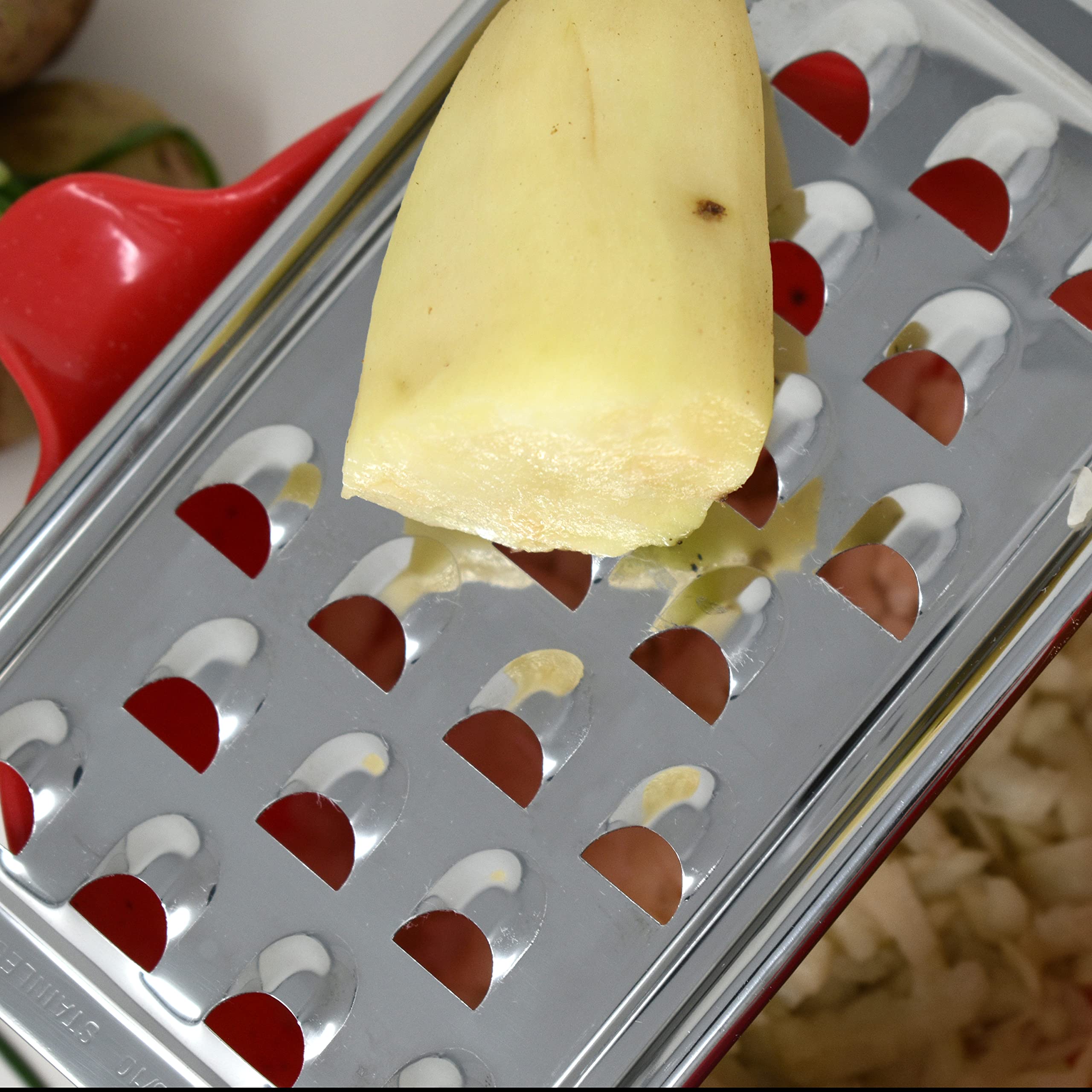 Norpro stainless steel potato grater hanging use shows easy storage.
