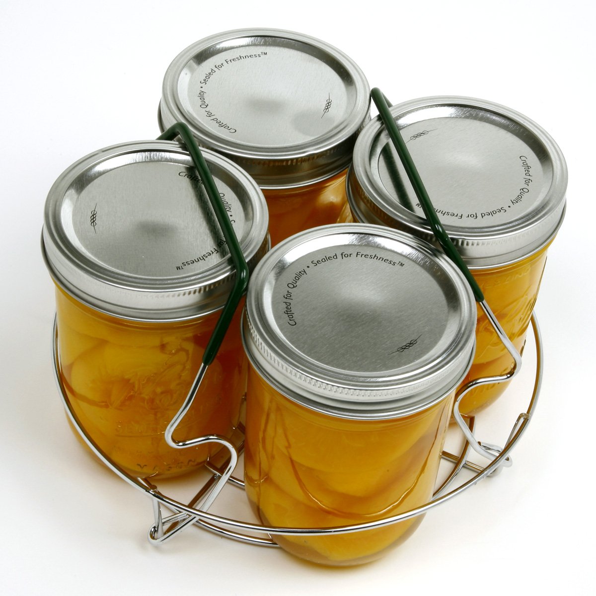 Norpro canning rack with contoured handles resting on pot rim offers easy placement.