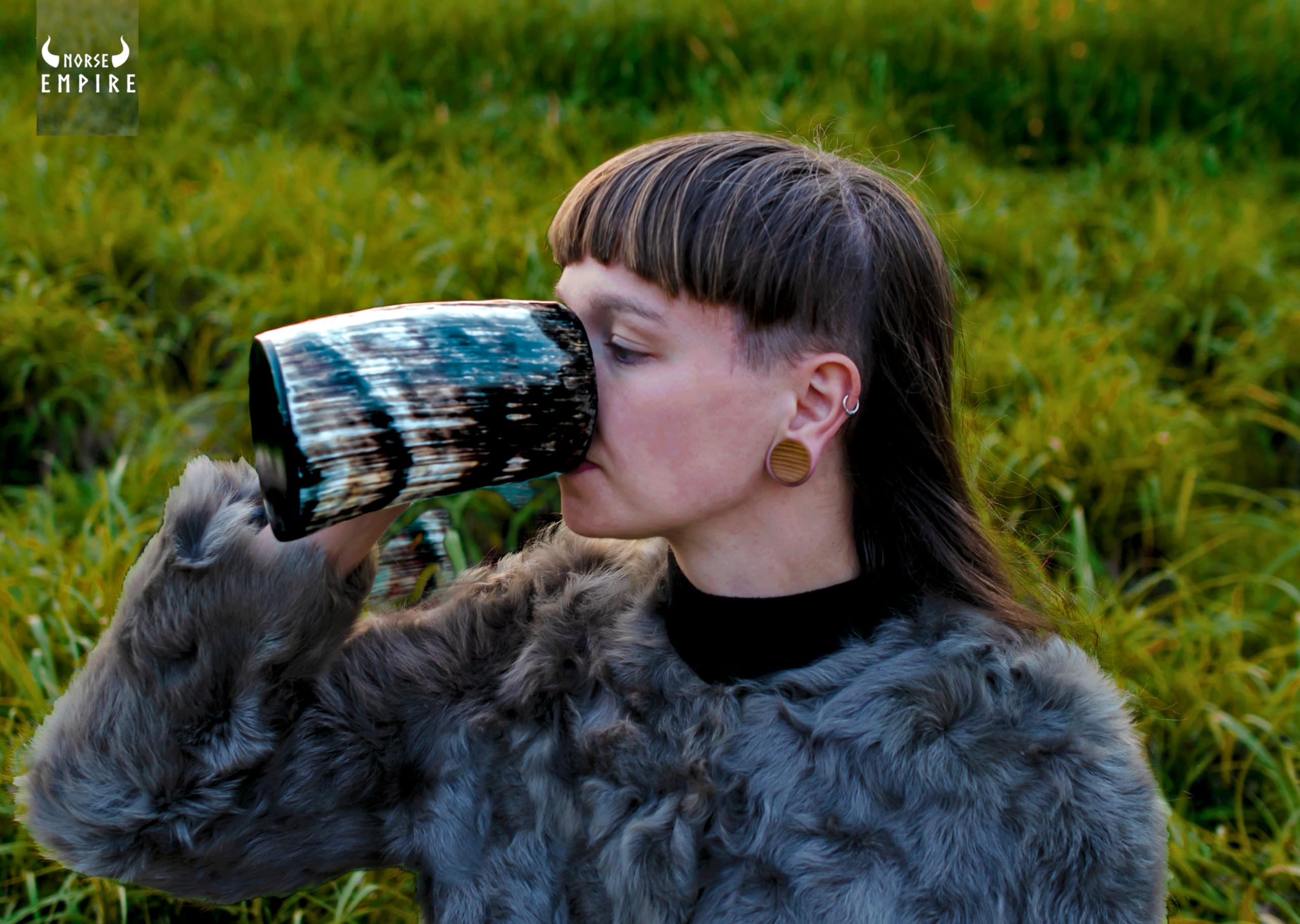 Norse Empire mug with polished natural colors and horn patterns.