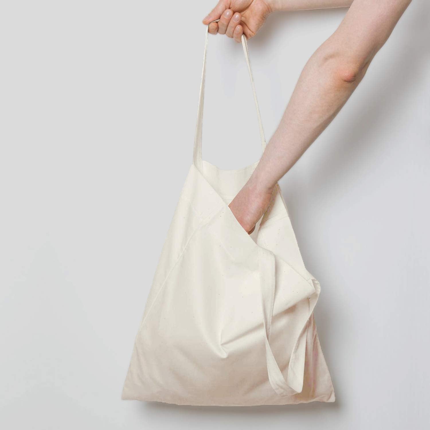 NPBAG natural cotton tote 15x16 side view with long handles for shoulder or hand carry.