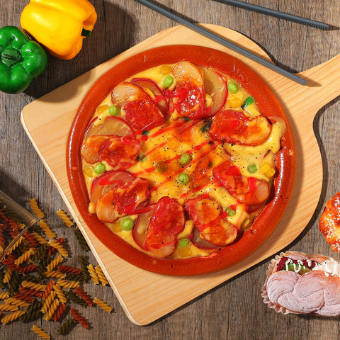 Nuogo wooden paddle serving tray doubles as a light cutting surface.