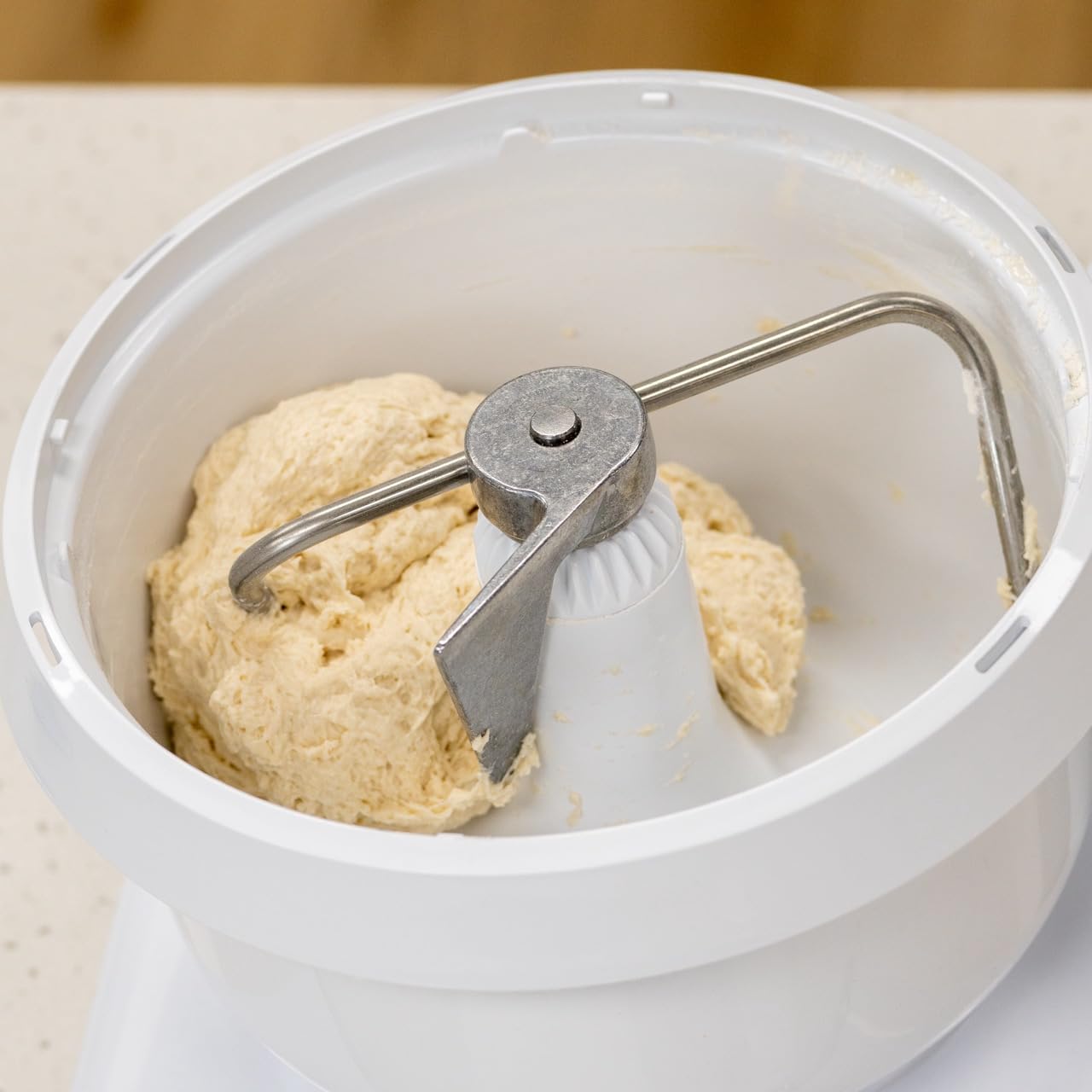 NutriMill mixer lid and splash ring reduce splatter during whipping.