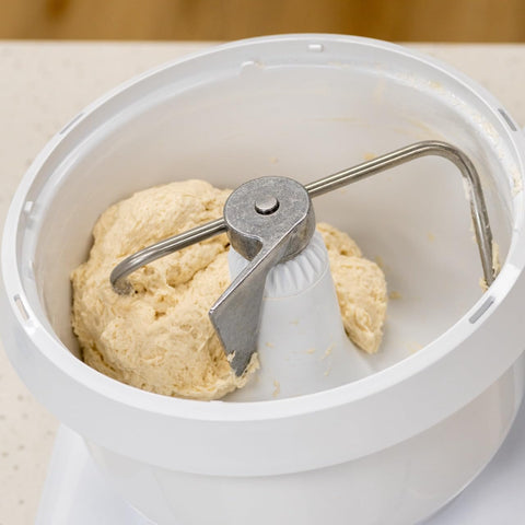 NutriMill mixer lid and splash ring reduce splatter during whipping.