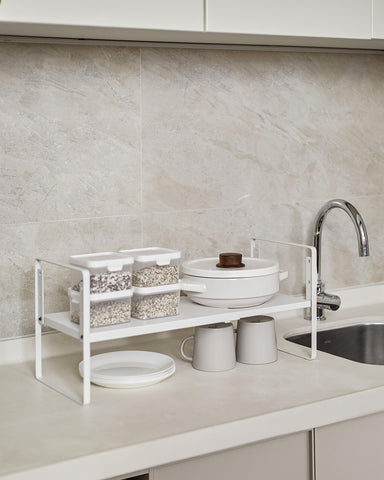 Nxconsu space-saving organizer keeps desktops and cupboards tidy.