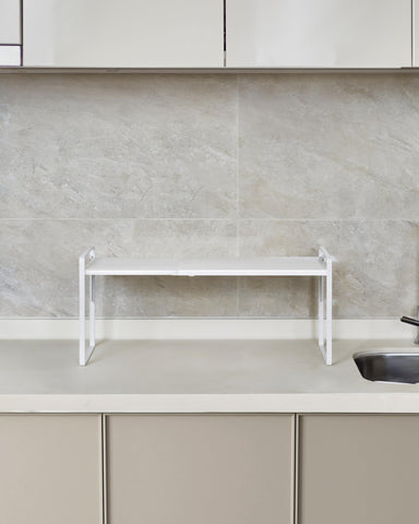 Nxconsu stackable shelf creates double-level storage for organized spaces.
