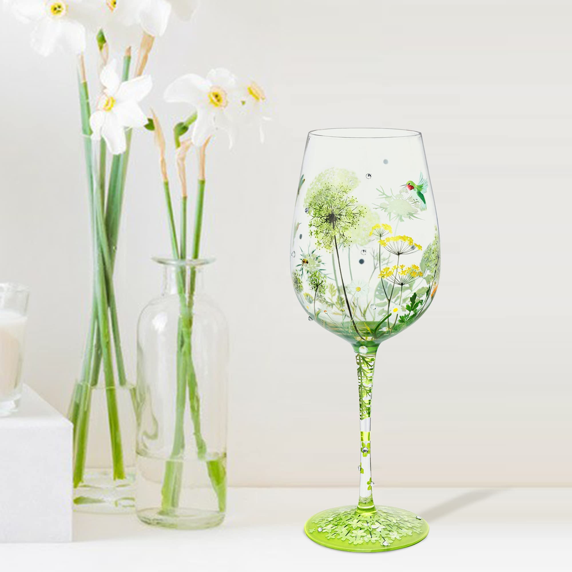 NymphFable closeup-artwork showcases flowers, birds, and dragonflies on glass.