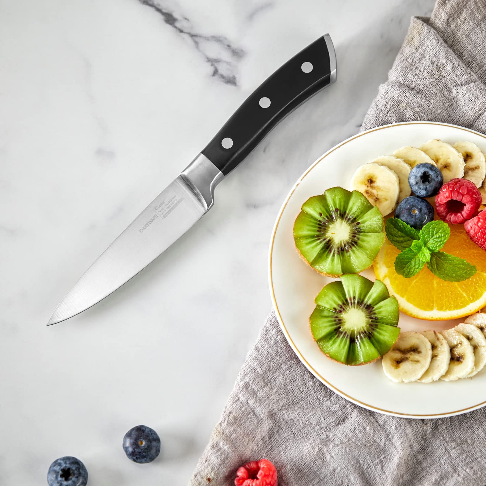 OAKSWARE paring knife with full tang and ergonomic handle for balanced control.