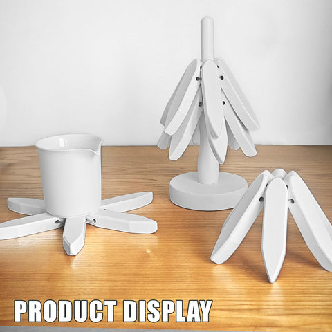White OFCTE trivet displayed on a bright kitchen shelf.