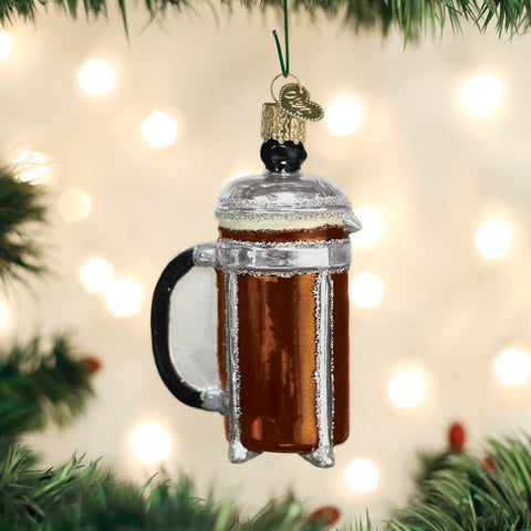 Old World Christmas coffee press ornament hand-painted detail highlights festive espresso-tones.