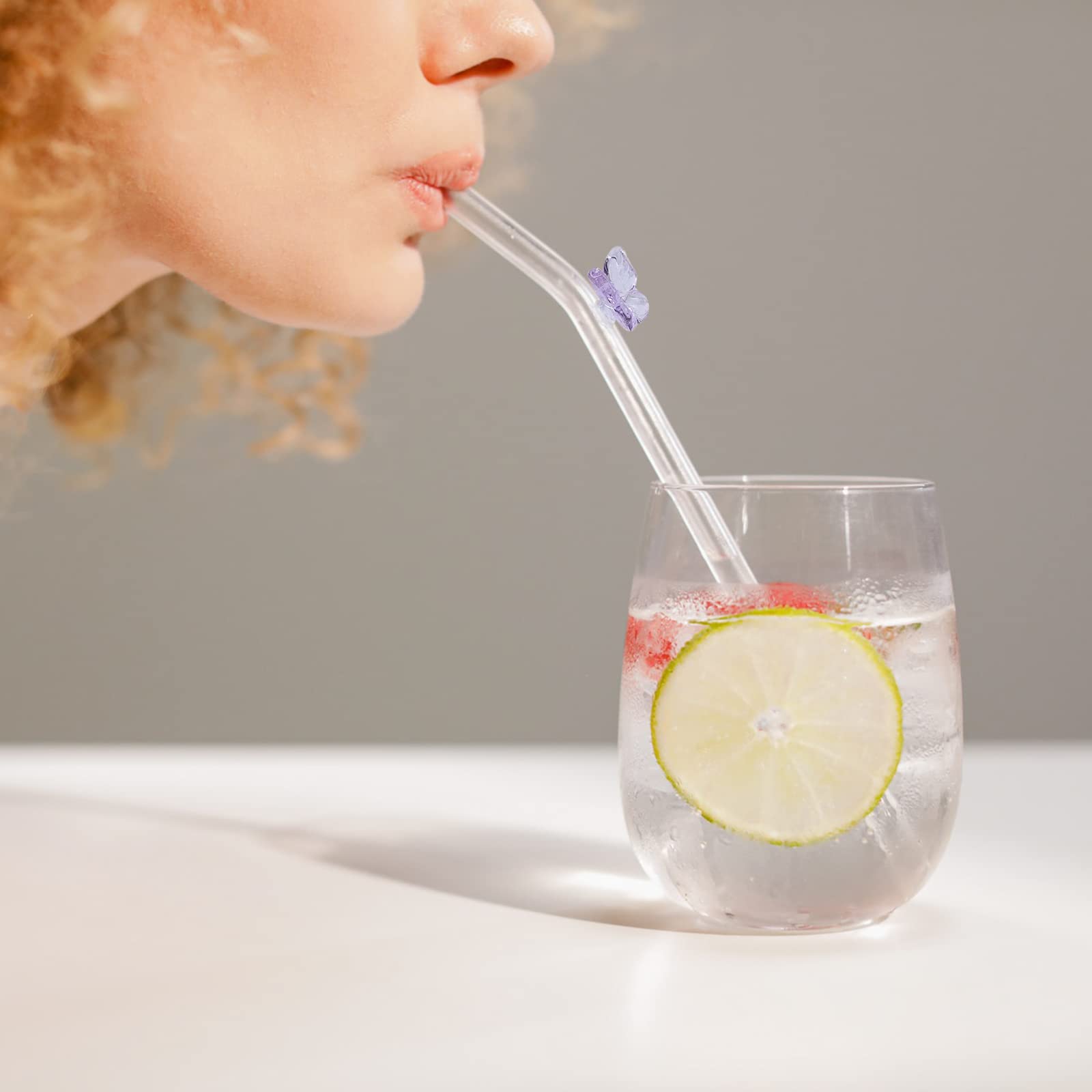Olpchee butterfly glass straw enhances presentation for juices and cocktails.