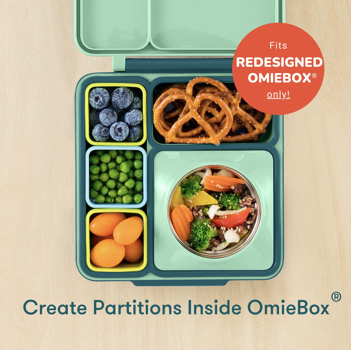OmieBox dip container blue-lime inside OmieBox partitions for organization.