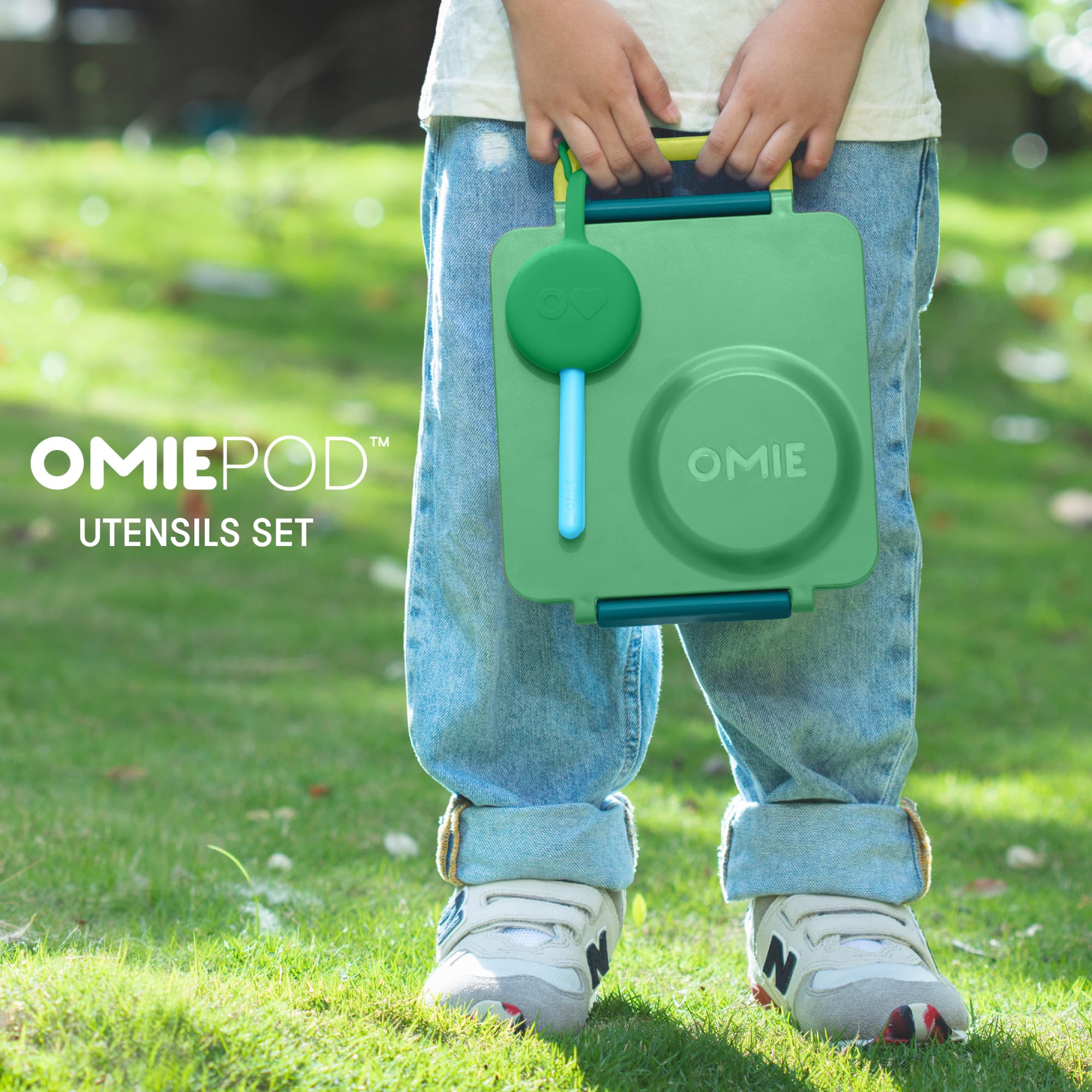 OmieBox mint-green spoon designed for small hands and comfort.
