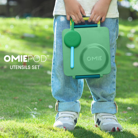 OmieBox mint-green spoon designed for small hands and comfort.