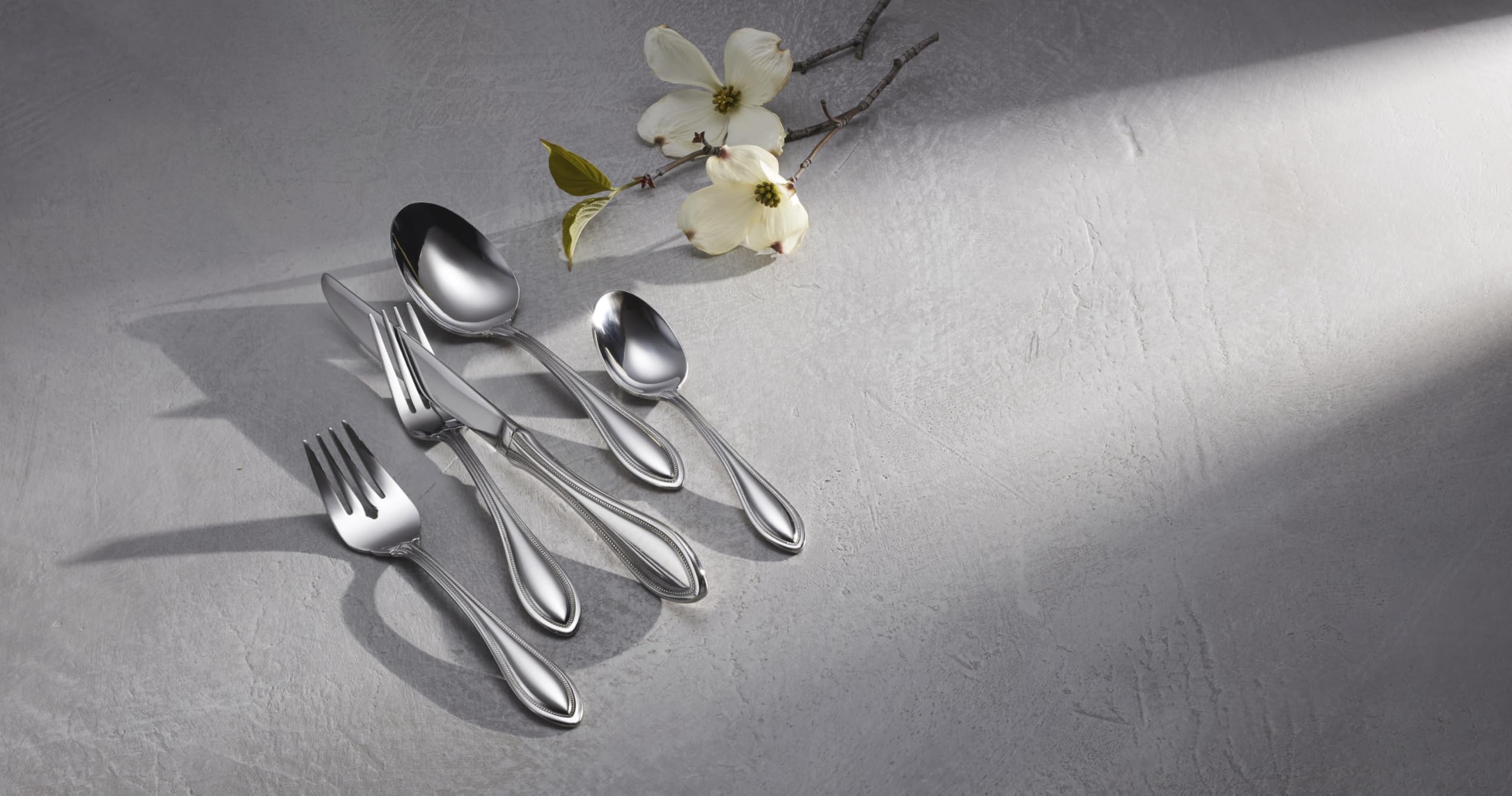 Oneida American Harmony teaspoons on a dining table for everyday use.