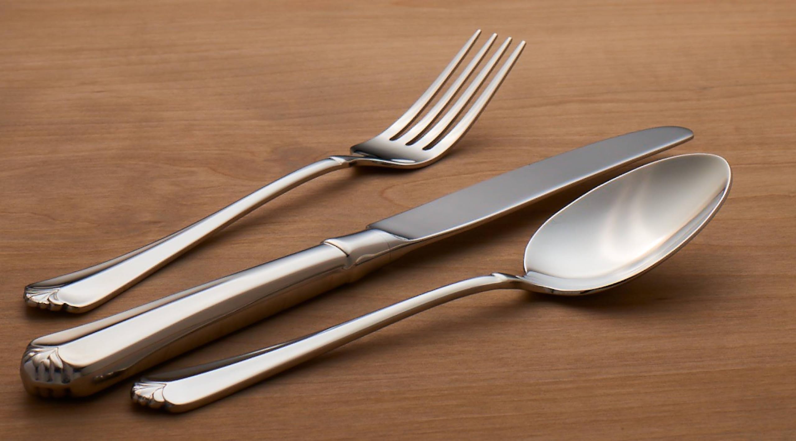 Juilliard serving spoon pairs with the flatware for versatile service.