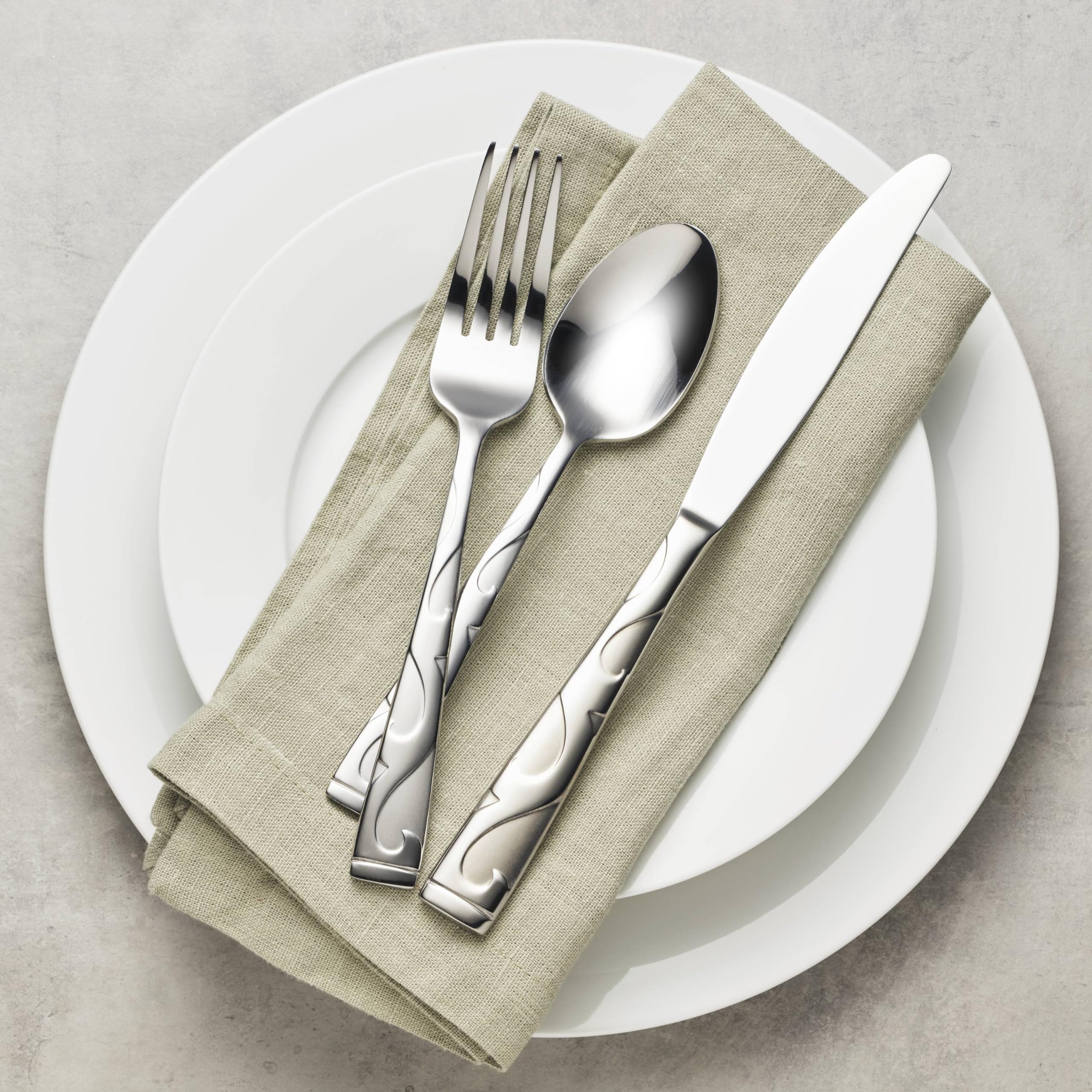 Oneida Tuscany serving and cutlery set shown together for a coordinated table setting