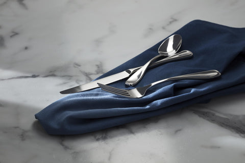 Oneida Voss mirror finish reflects light for a polished table setting